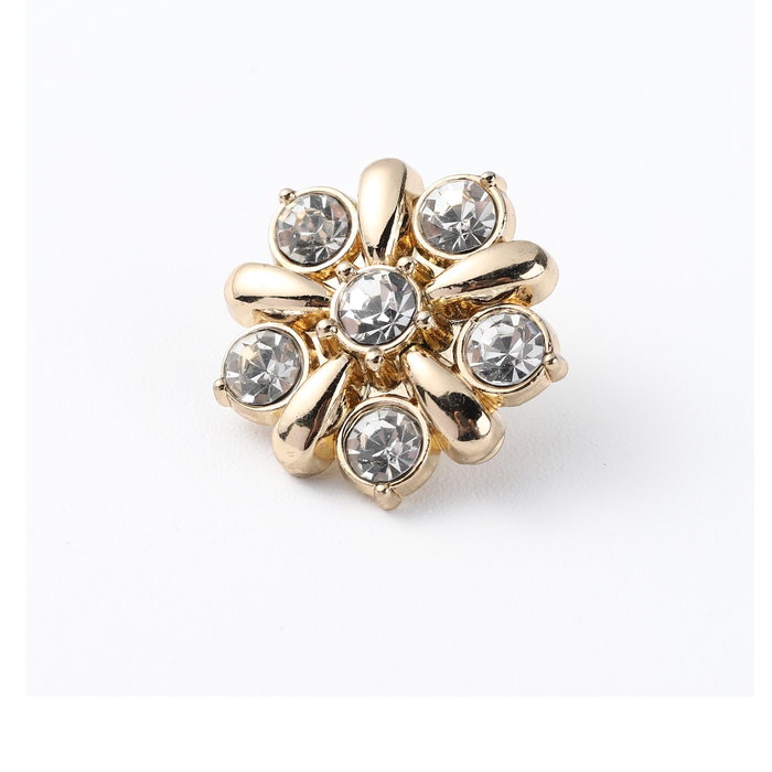 Gold flower shank button with crystal centre