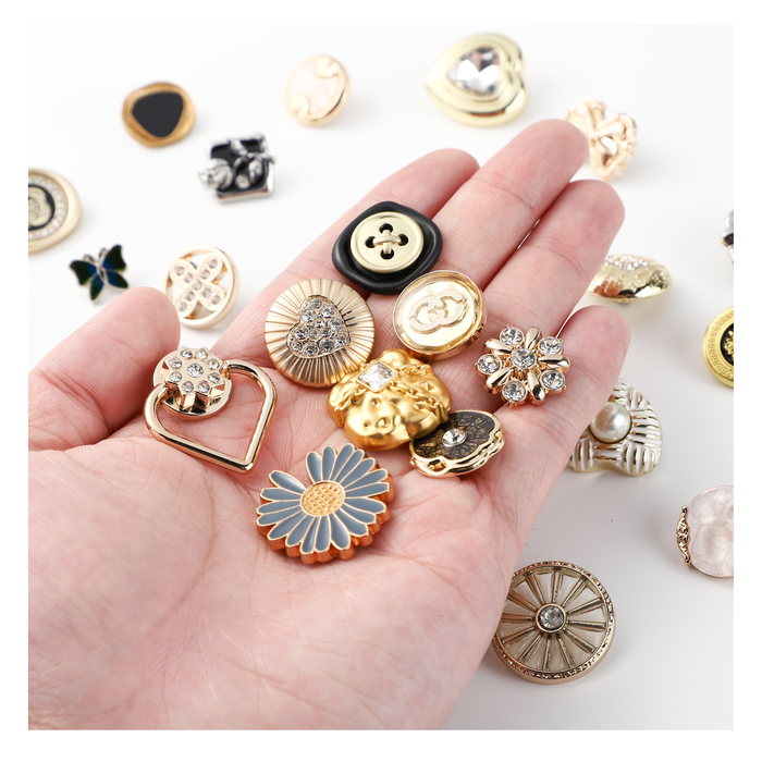 Metal button spread including sunburst and floral designs